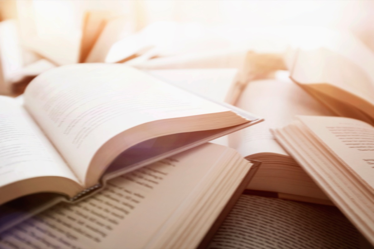 Open books with warm sunlight, evoking the quiet focus of study